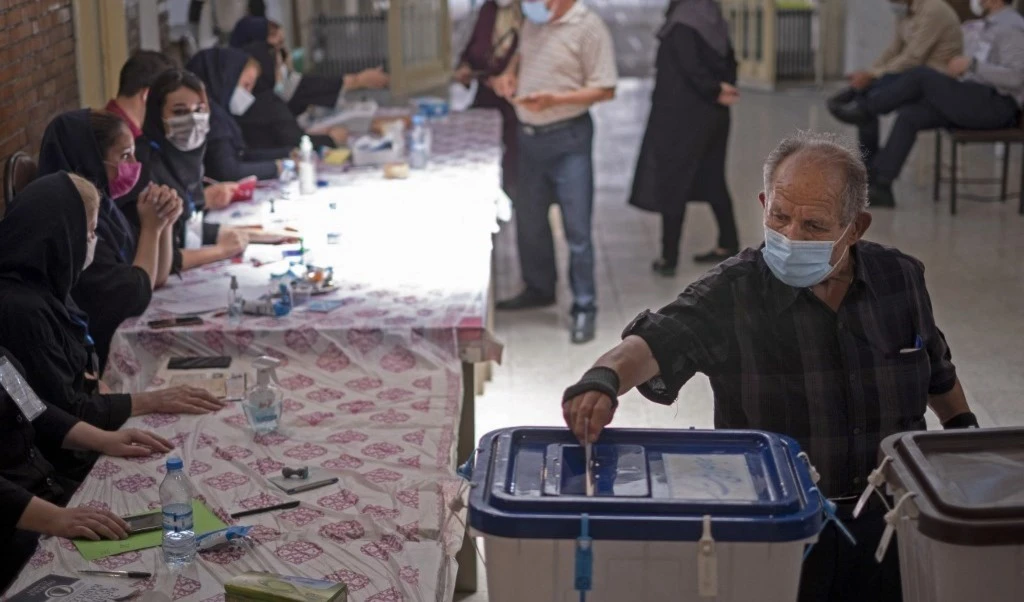 A citizen casts his vote in the Iranian presidential elections (AFP) A citizen casts his vote in the Iranian presidential elections (AFP)