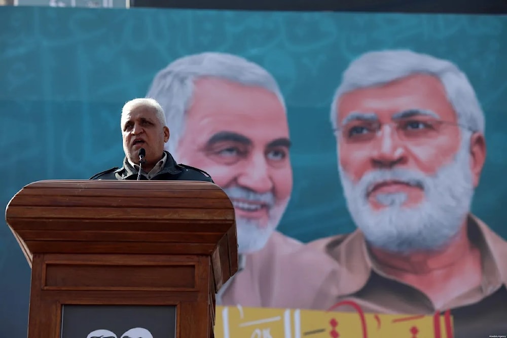 PMF chief Faleh al-Fayyad delivers a speech commemorating the assassination of the IRGC's Quds Force commander, Maj Gen Qasem Soleimani, and PMF vice president Abu Mahdi Al-Muhandis, on 3 January 2021 in Baghdad, Iraq (AA Photo)