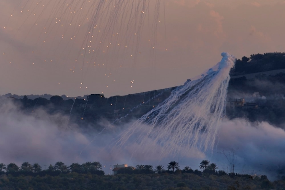 White phosphorus shells from Israeli artillery explode over Dahaira, a Lebanese border village with occupied Palestine, south Lebanon, October 16, 2023 (AP)