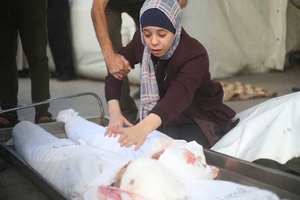 A Palestinian woman mourns children killed in the Israeli bombardment of the Gaza Strip in Rafah on Saturday, Oct. 21, 2023 (AP)