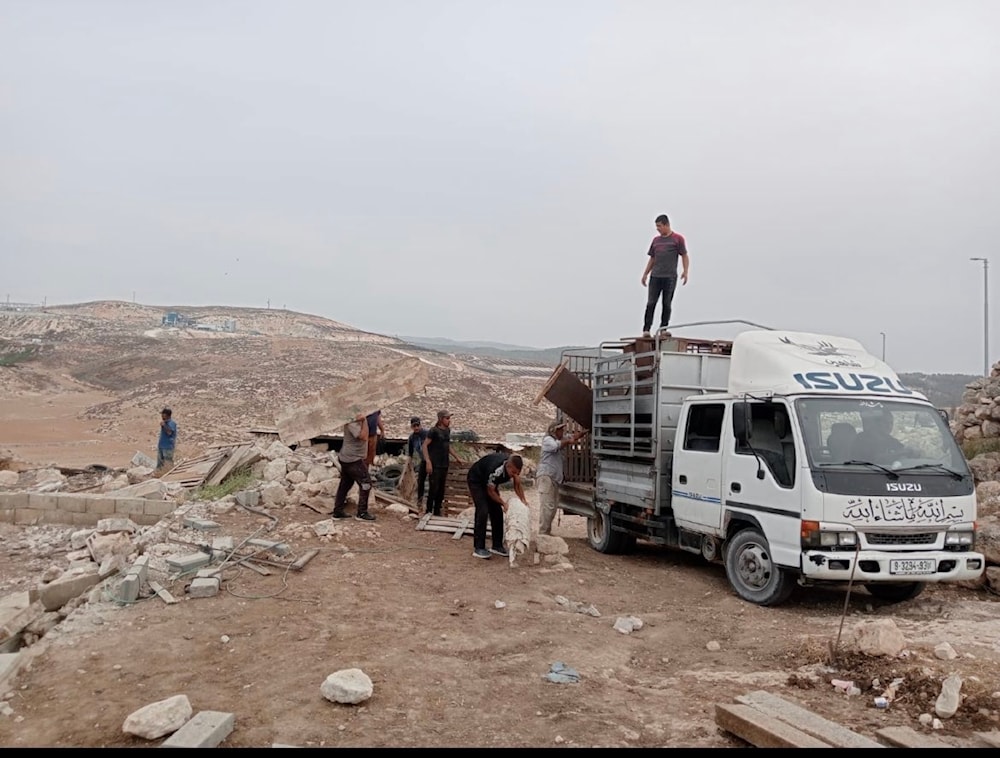  A pickup truck retrieving additional possessions for Palestinians forcibly displaced from Khirbet Zanuta. (Twitter)