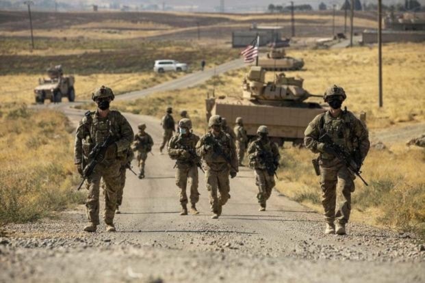 U.S. soldiers make their way to a oil production facility to meet with its management team, in Syria, Oct. 27, 2020. (U.S. Army photo by Spc. Jensen Guillory)