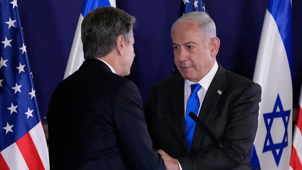 Israeli Prime Minister Benjamin Netanyahu shakes hands with Secretary of State Antony Blinken on Oct. 12. (AFP)