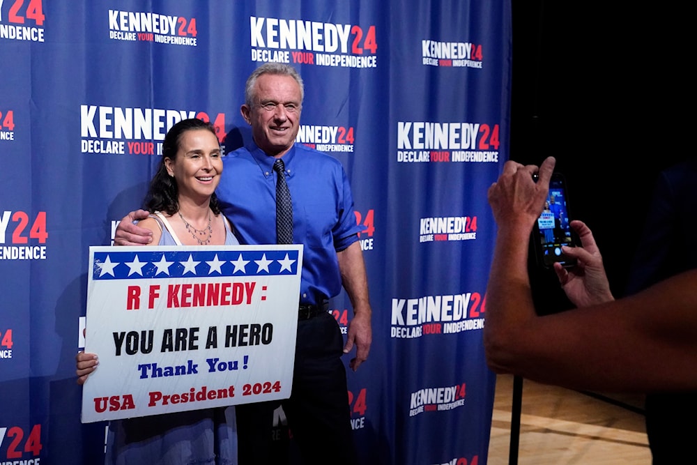 poses for a photo with presidential candidate Robert F. Kennedy Jr., on Oct. 12, 2023, in Miami, Fla. (AP)