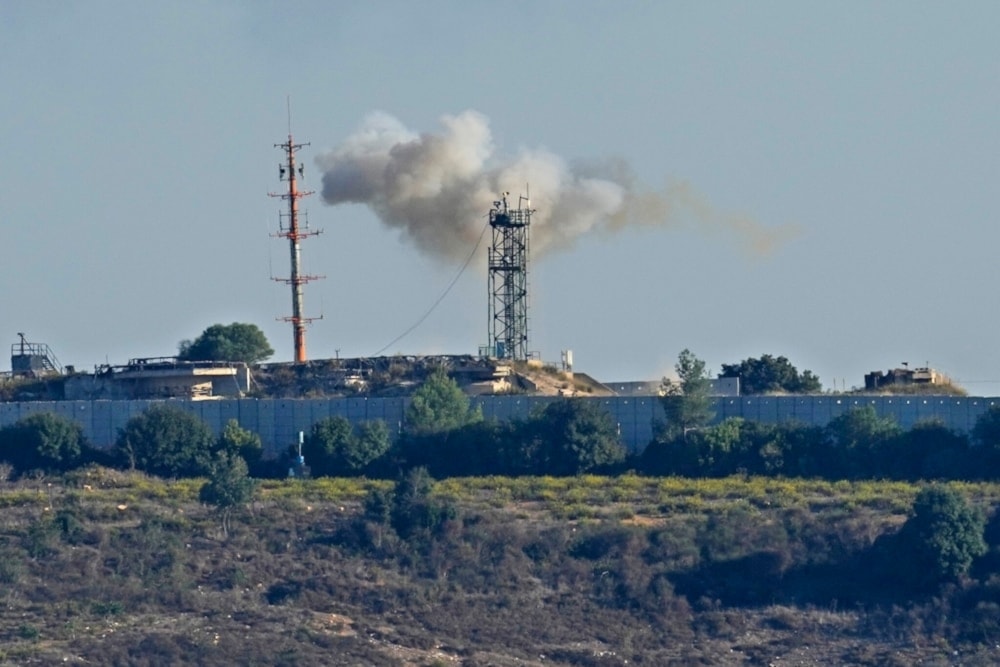 Smoke rises from inside an Israeli military outpost which was hit by missiles launched by Hezbollah as seen from Tair Harfa village, a Lebanese border village, south Lebanon, October 20, 2023 (AP Photo/Hassan Ammar)