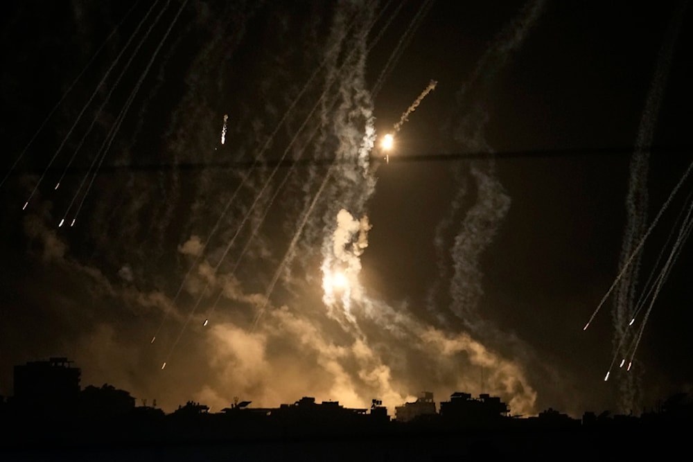 Smoke and flares rise over Gaza City during an Israeli strike in the Gaza Strip, as seen from southern Israel, Friday Nov. 10, 2023. (AP Photo/Leo Correa)