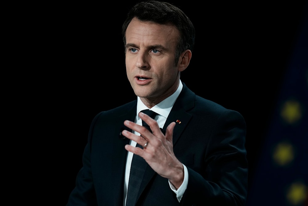 French President Emmanuel Macron delivers his speech during a presidential campaign news conference in Aubervilliers, north of Paris, France, Thursday, March 17, 2022. (AP)