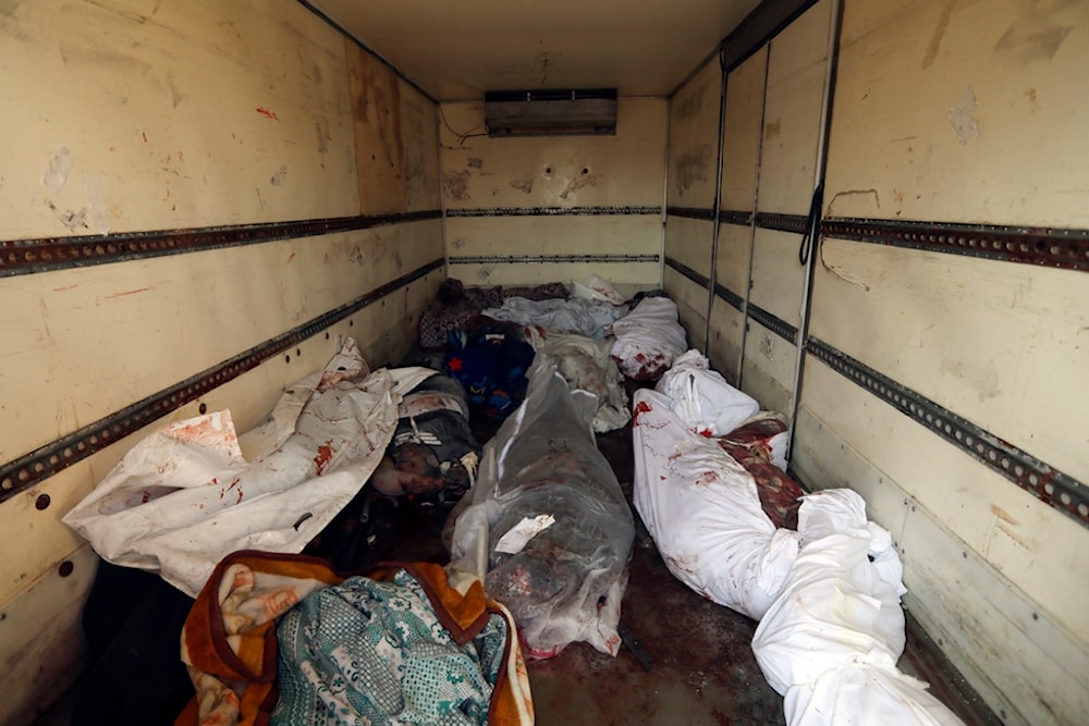 Bodies of martyred Palestinians killed in Israeli airstrikes, are seen in a truck in the al-Shifa hospital in Gaza City, November 5, 2023 (AP)