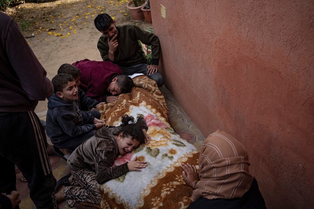 Palestinians mourn their relatives killed in the Israeli bombardment of the Gaza Strip, in the hospital in Khan Younis, Saturday, Nov. 11, 2023. (AP)