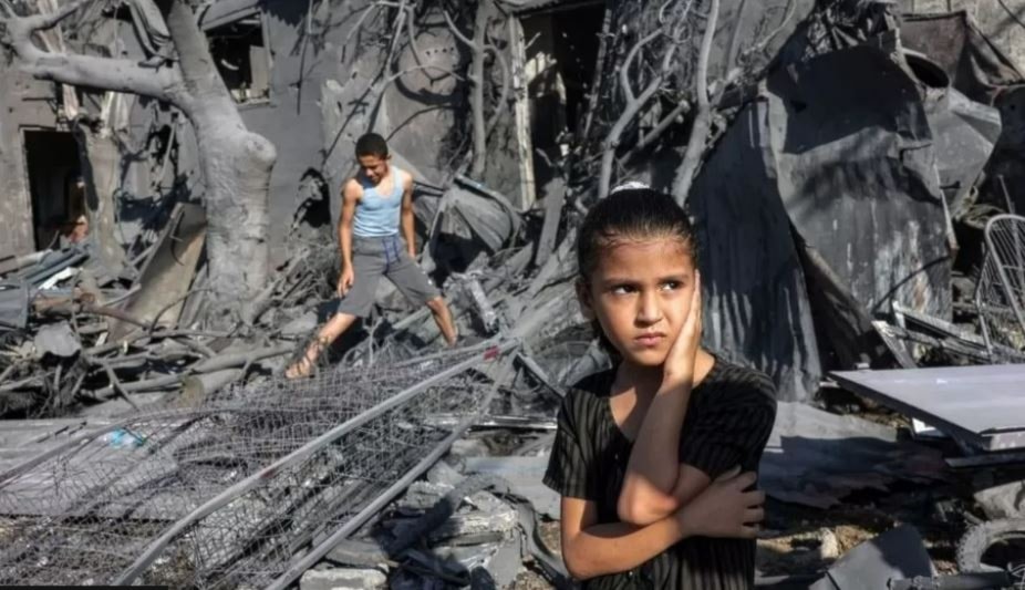 Palestinian children inspect their home after an Israeli airstrike reduced it to rubble (AFP via Getty Images)