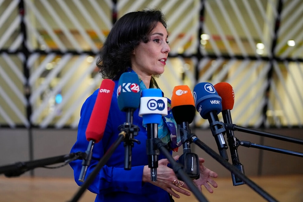 Belgium's Foreign Minister Hadja Lahbib speaks with the media as she arrives for a meeting of EU foreign ministers at the European Council building in Brussels on Monday, Jan. 23, 2023 (AP)