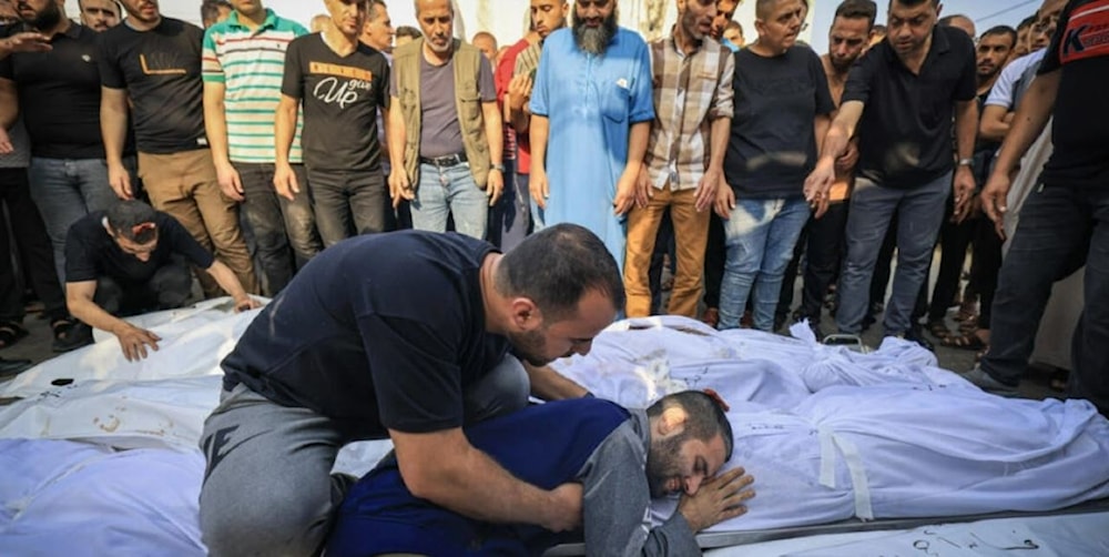 A Palestinian man mourns the loss of a family member following a strike in the southern town of Khan Yunis (AFP)