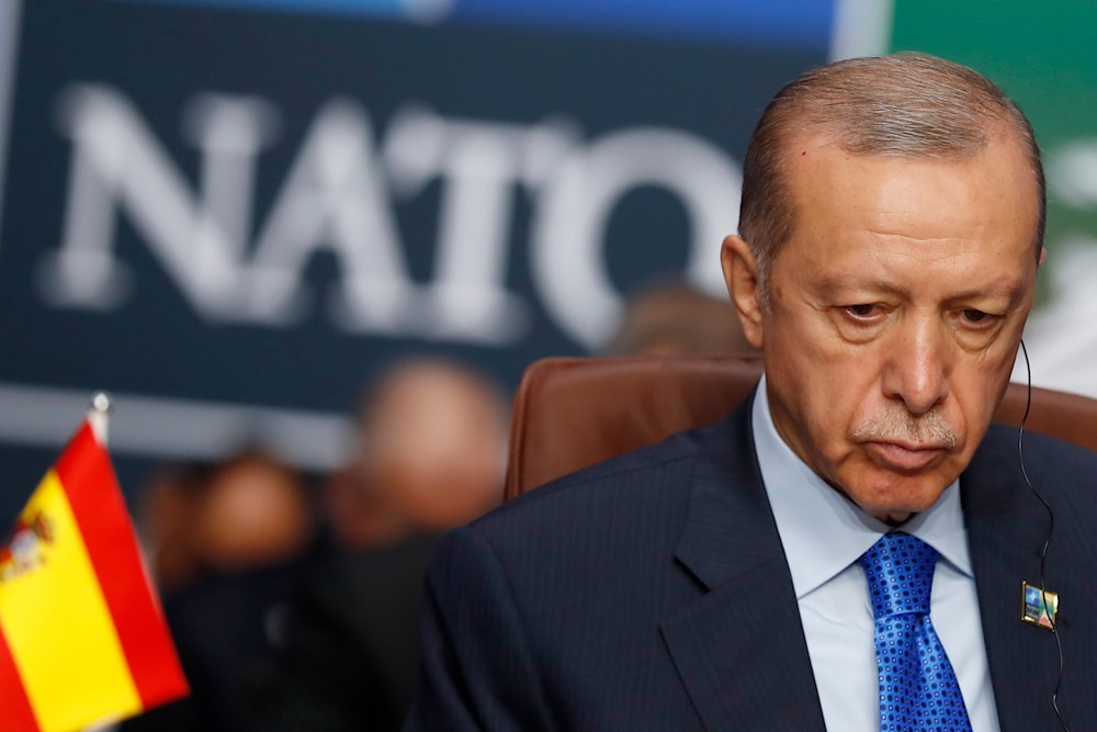 Turkish President Recep Tayyip Erdogan waits for the start of a round table meeting of the North Atlantic Council during a NATO summit in Vilnius, Lithuania, on July 11, 2023. (AP)