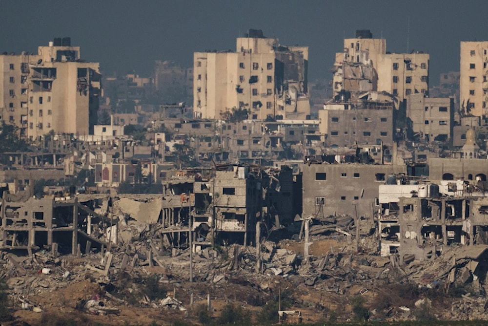 Destroyed buildings stand in the Gaza Strip, as seen from southern occupied Palestine, Thursday, Nov. 16, 2023 (AP Photo)