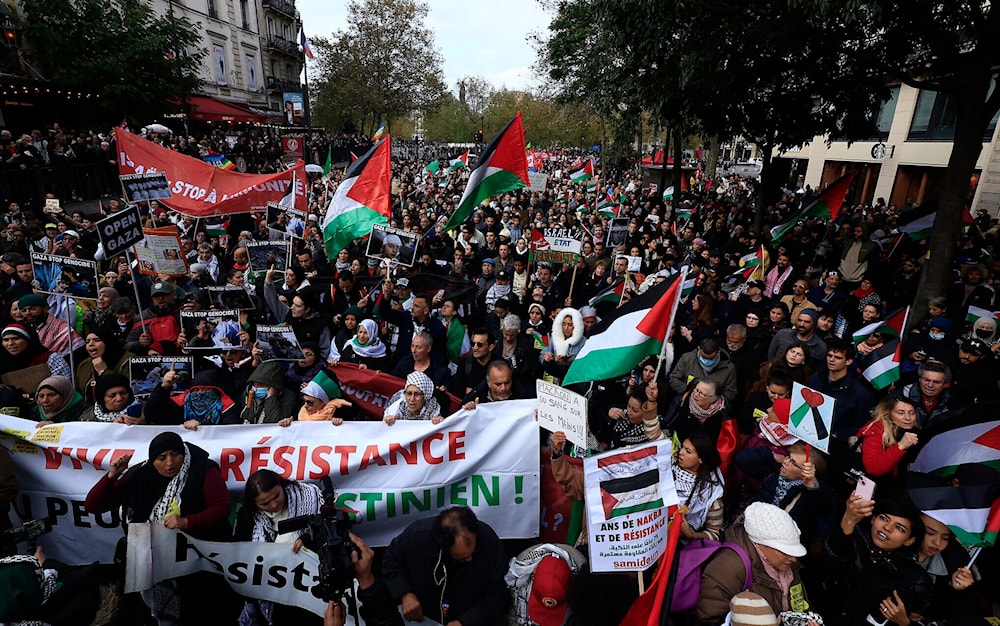 Protesters chant slogans as they march on Paris during a pro-Palestinian demonstration, November 4, 2023. (AP)