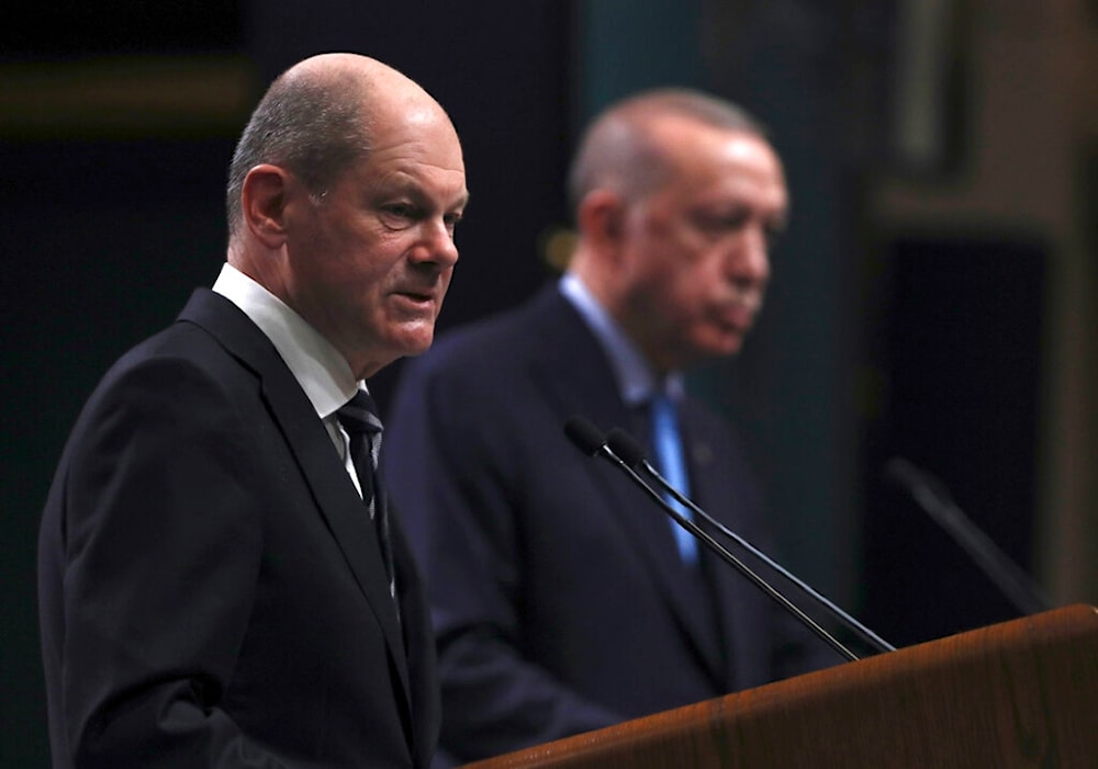 Turkish President Recep Tayyip Erdogan and Germany's Chancellor Olaf Scholz speak to the media after their talks, in Ankara, Turkey, Monday, March 14, 2022 (AP)