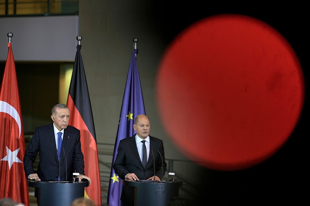 Turkey's President Recep Tayyip Erdogan, left, and German Chancellor Olaf Scholz talk to the media at a press conference at the chancellery in Berlin, Germany, November 17, 2023 (AP)