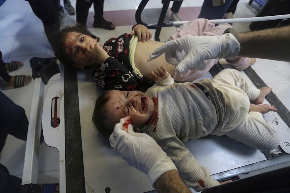 Wounded Palestinian children receive treatment at the al-Shifa hospital, following Israeli airstrikes on Gaza on Oct. 23, 2023. (AP)