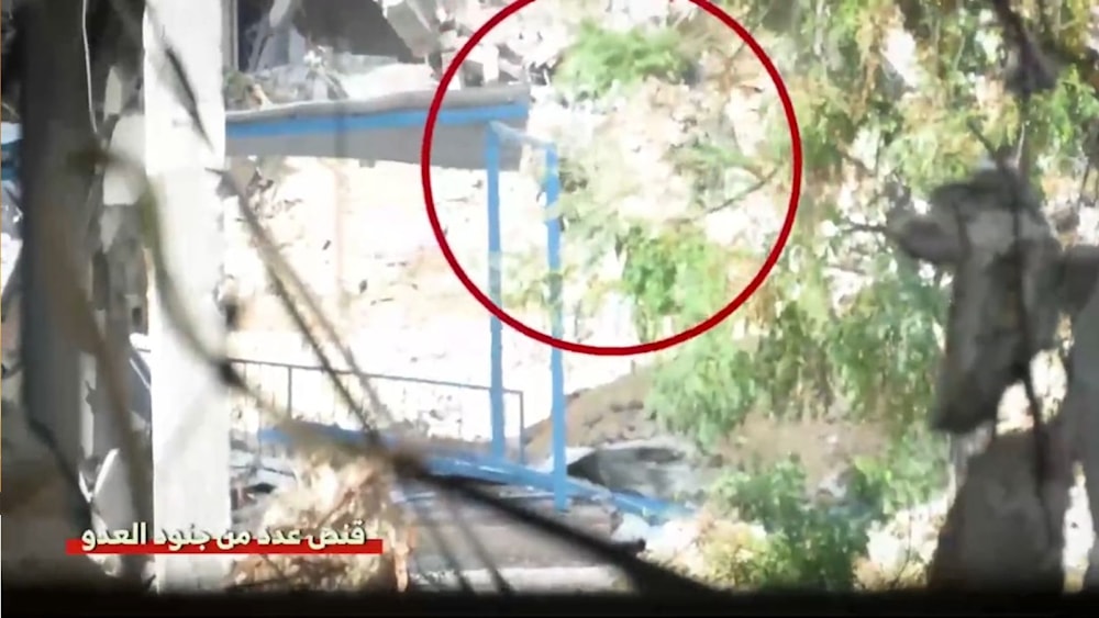 A screegrab from a video published by the Military Media of Al Qassam Brigades depicting the sniping of Israeli soldiers in Gaza (Military Media)