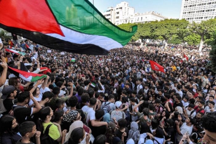 Protesters gather for a demonstration outside the French embassy headquarters along the Avenue Habib Bourguiba in the center of Tunis in solidarity with Palestine on October 18, 2023. (AFP)