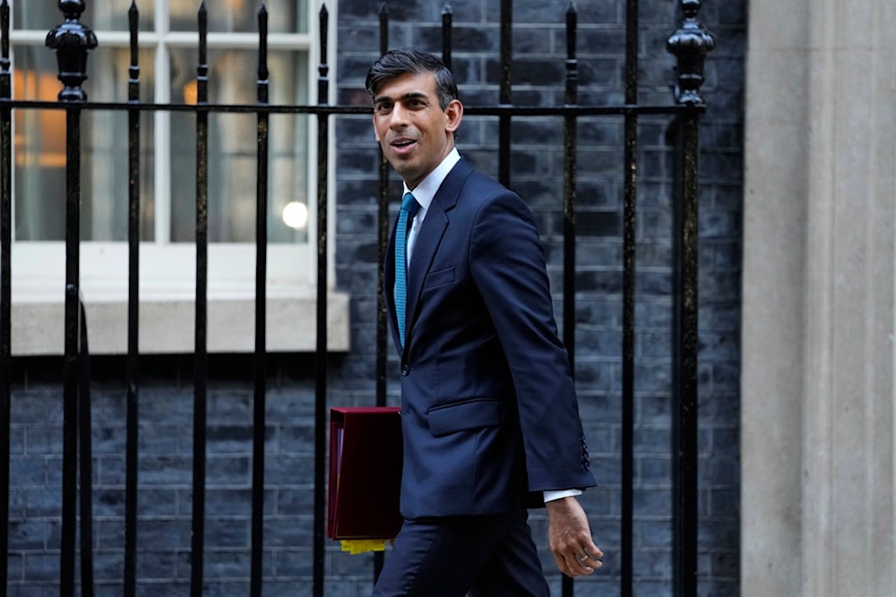 British Prime Minister Rishi Sunak leaves 10 Downing Street to attend the weekly session of Prime Ministers Questions in Parliament in London, November 15, 2023 (AP)