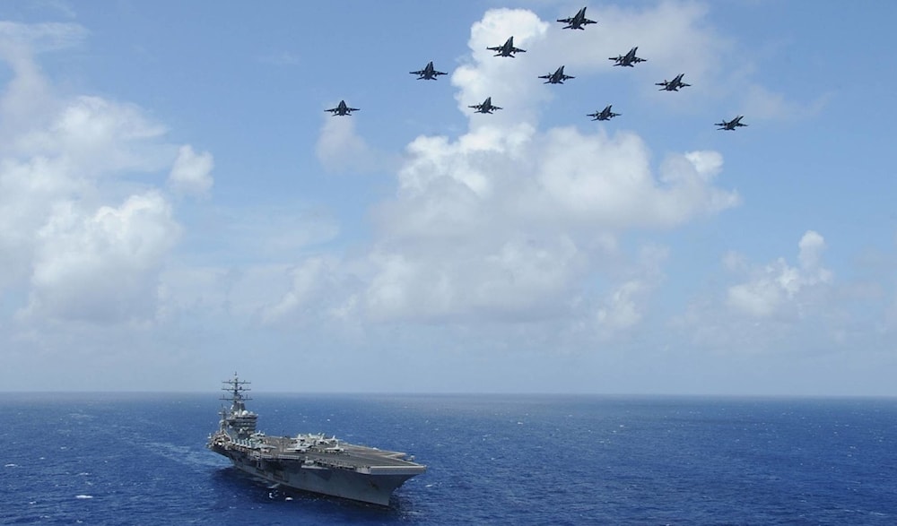 Fighter jets fly over the aircraft carrier USS Dwight Eisenhower. (AFP)