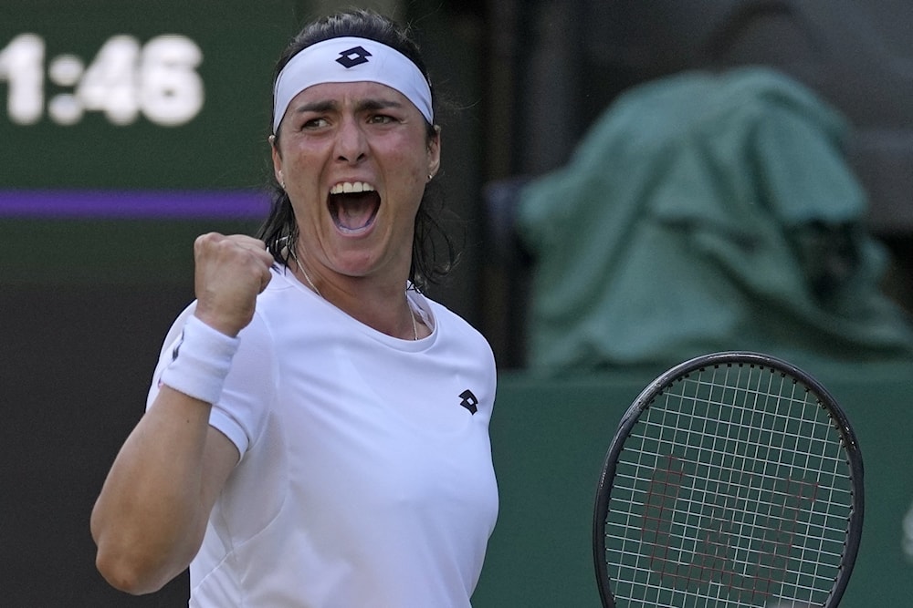 Ons Jabeur celebrates after winning a point against Marie Bouzkova in the Wimbledon women's singles quarterfinal, London, England, July 5, 2022. (AP)