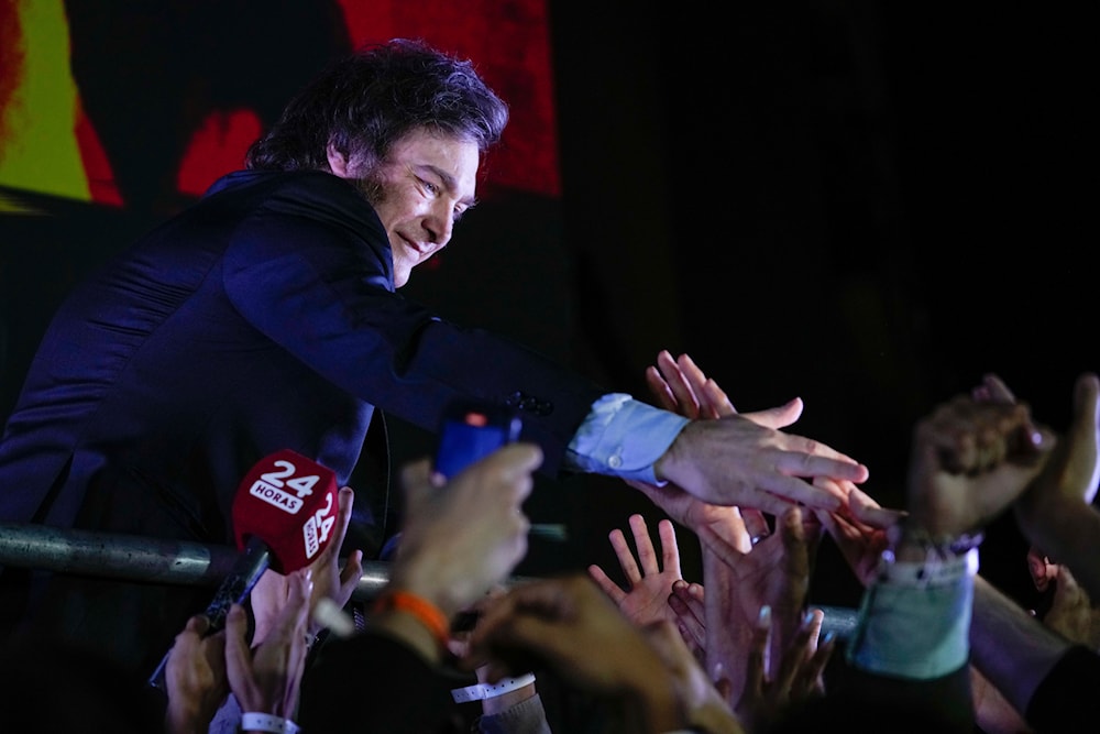 Presidential candidate of the Liberty Advances coalition Javier Milei greets supporters after winning the presidential runoff election in Buenos Aires, Argentina, on Nov. 19, 2023. (AP)