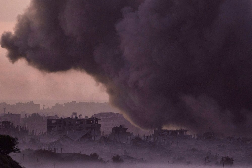 Smoke rises following an Israeli airstrike in the Gaza Strip, as seen from southern occupied Palestine, November 21, 2023 (AP)