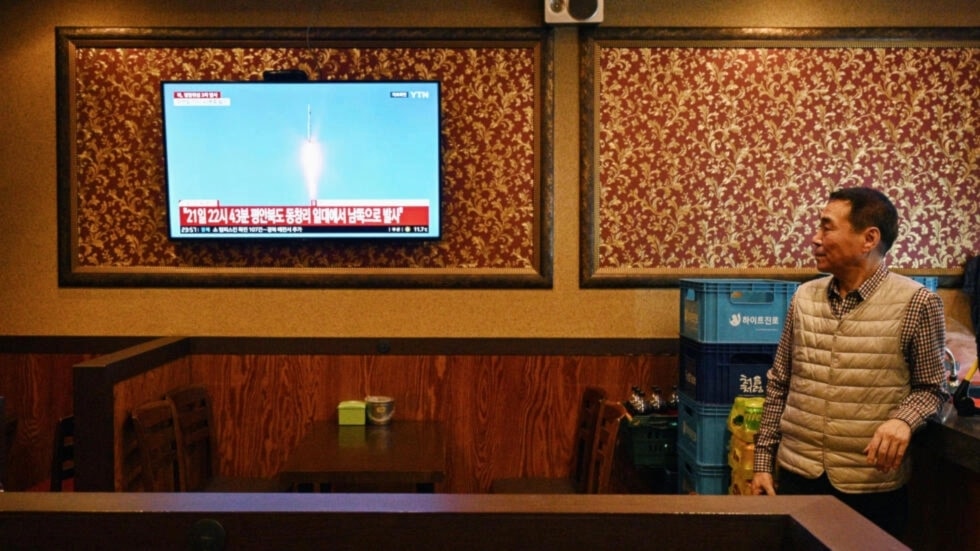 A man watches a television showing a news broadcast at a restaurant in Seoul. (AFP)