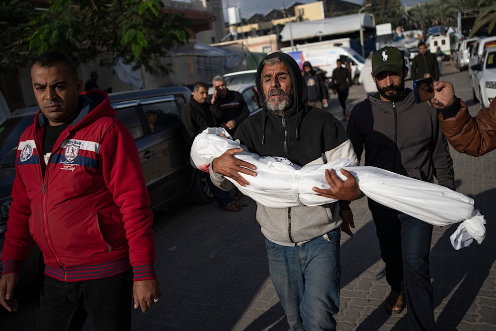 Palestinians mourn their relatives killed in the Israeli bombardment of the Gaza Strip, in the hospital in Khan Younis, Tuesday, Nov. 21, 2023. (AP)