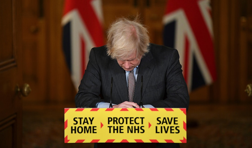 Britain'sPrime Minister Boris Johnson reacts while leading a virtual news conference on the COVID-19 pandemic, inside 10 Downing Street in central London on Jan. 26, 2021. (AP)