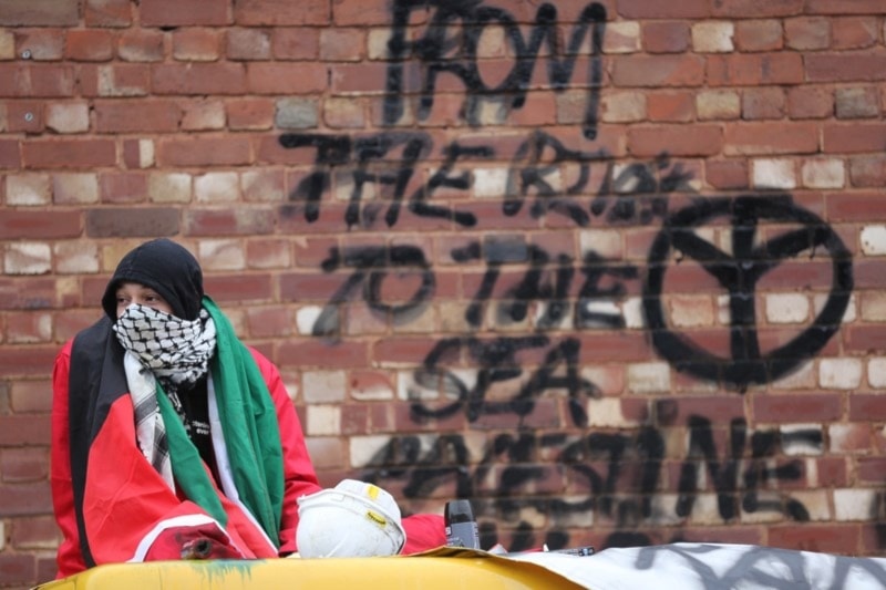 'Palestine Action' activist protesting in front of an Israeli arms factory in the UK, June 06, 2022 (Palestine Action website)