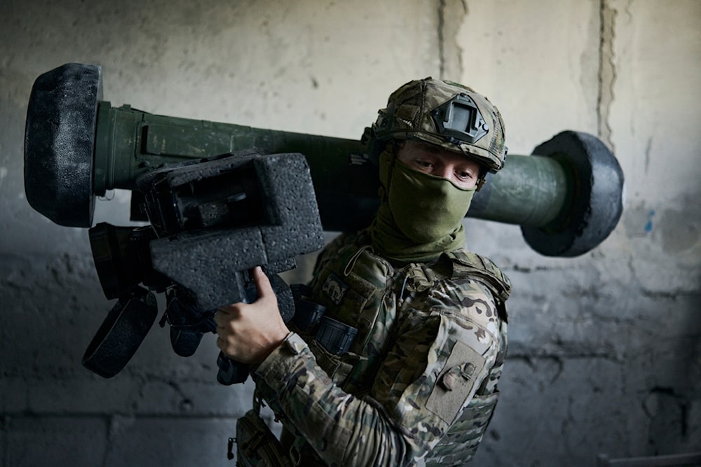 A Ukrainian soldier holds an anti-tank missile in his position in Avdiivka, Donetsk region, Friday, Aug. 18, 2023 (AP Photo/Libkos)