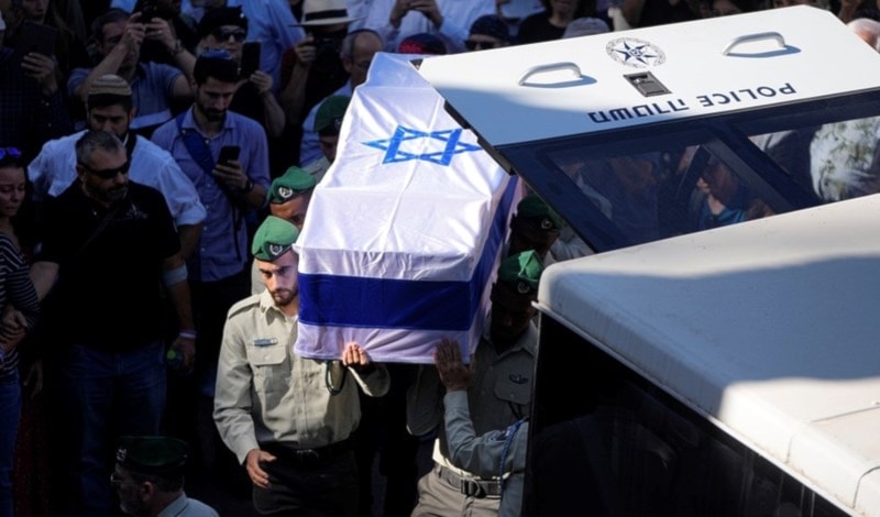 Israeli Occupation Forces carry the coffin of a dead officer in Occupied Al Quds, Palestine on Nov. 9, 2023 (AP)