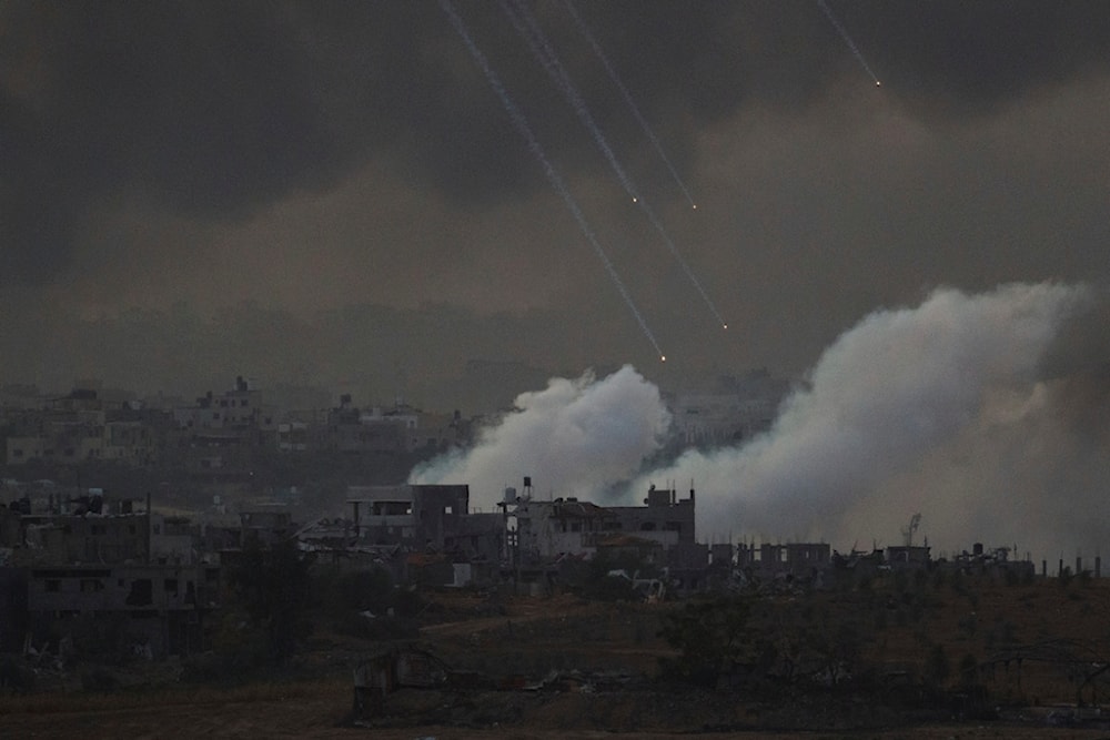 Smoke rises following an Israeli shelling in the Gaza Strip, as seen from southern occupied Palestine, November 22, 2023 (AP)