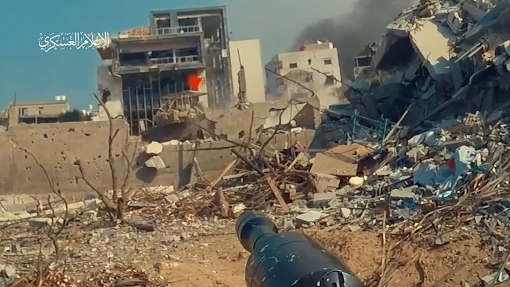 A screen grab from a video posted by Al-Qassam Brigades depicting its fighters engaging an Israeli Merkava tank with an Al-yassin 105 RPG (Military Media)