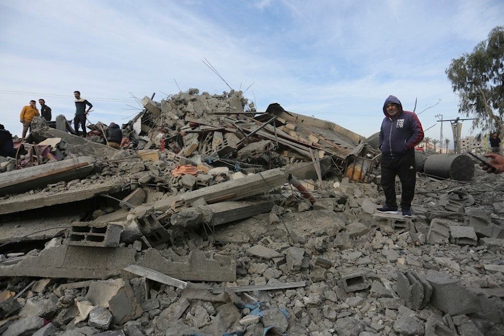 Palestinians look at destruction by the Israeli bombardment of the Gaza Strip in Rafah on Wednesday, Nov. 22, 2023 (AP Photo/Hatem Ali)