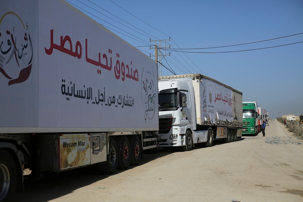Trucks carrying humanitarian aid enter Gaza Strip from Egypt in Rafah as a temporary ceasefire went into effect Friday, Nov. 24, 2023 (AP Photo/Hatem Ali)
