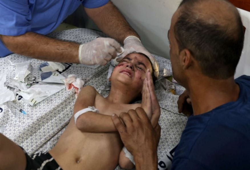 A boy is treated for injuries at a hospital in the city of Rafah, in the southern Gaza Strip, Oct.12, 2023, due to an Israeli airstrike on a residential building. ( AFP via Getty Images)