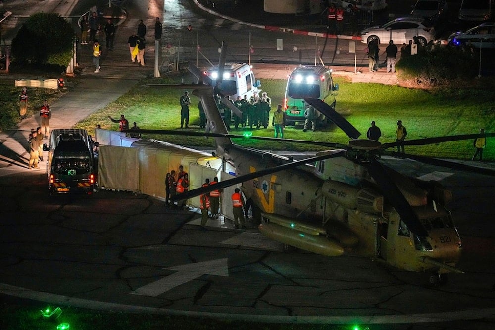 A helicopter carrying hostages released by Hamas lands at Schneider Medical Center in 'Petah Tikva', occupied Palestine, November 24, 2023 (AP)