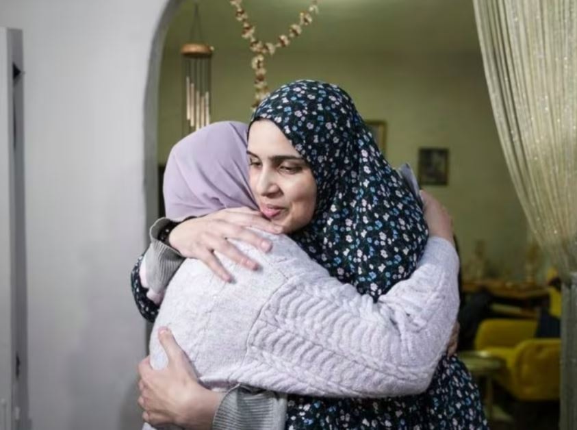 Marah Bakir, right, a former Palestinian prisoner who was released by the Israeli authorities, is welcome at her family house in the east Al-Quds neighborhood of Beit Hanina, Friday, Nov. 24, 2023. (AP)