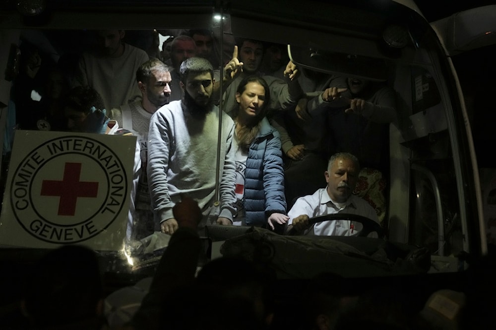 Palestinian prisoners released by Israel arrive by International Committee of the Red Cross bus to the West Bank town of al-Bireh Sunday Nov. 26, 2023. (AP)
