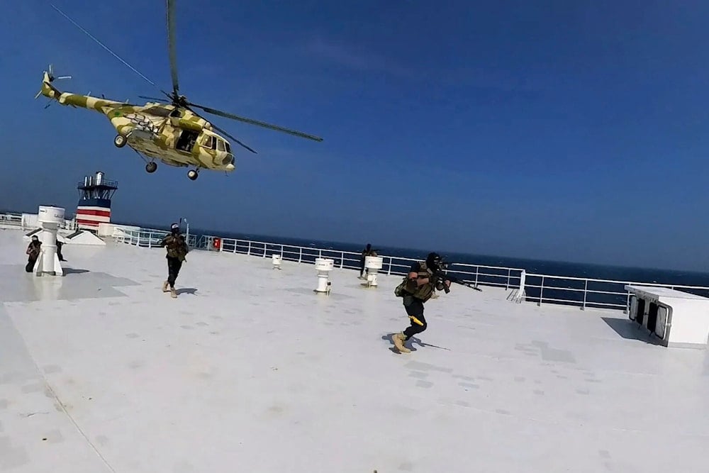 This photo released by the Houthi Media Center shows Houthi forces boarding the cargo ship Galaxy Leader on Sunday, Nov. 19, 2023. (AP)