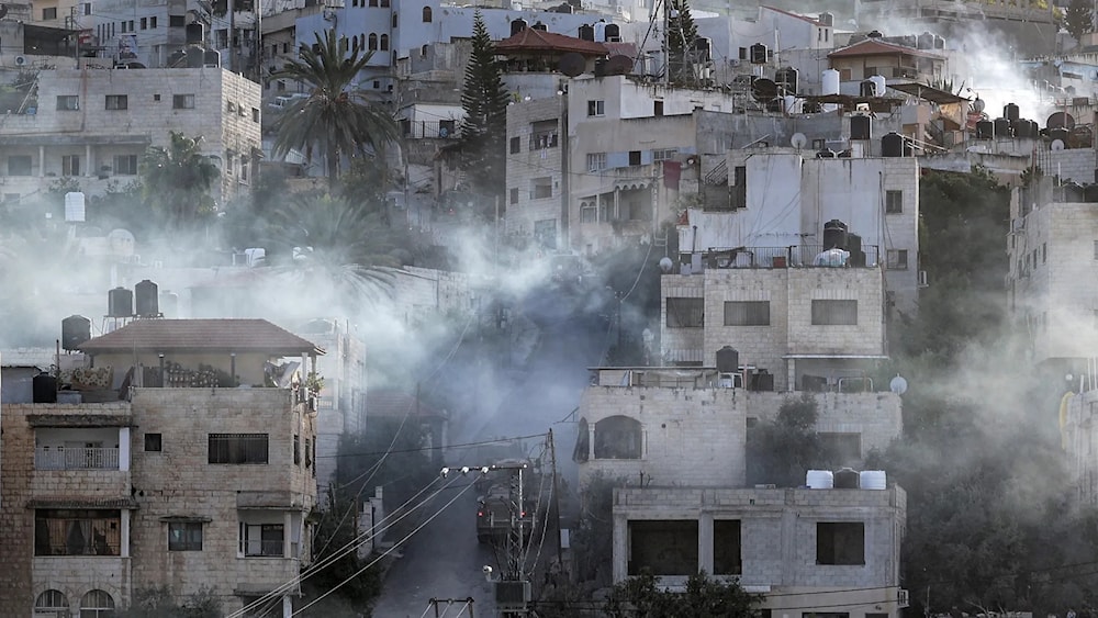 IOF vehicles enter the Jenin refugee camp in the occupied West Bank city of Jenin. (AFP)