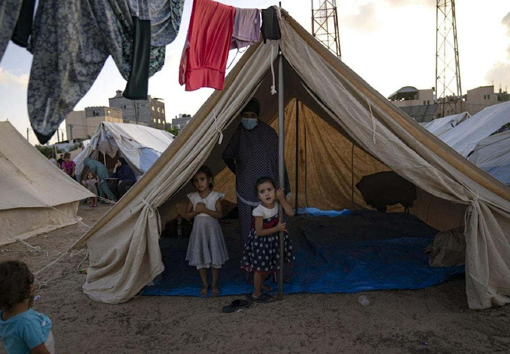 Palestinian children displaced by the Israeli bombardment of the Gaza Strip in Khan Yonis on October 19, 2023. (AP)