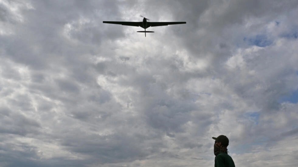 An operator controls a reusable airstrike “Punisher” drone made by the Ukrainian company UA Dynamics during a test in Kyiv region on August 11, 2023. (AFP)