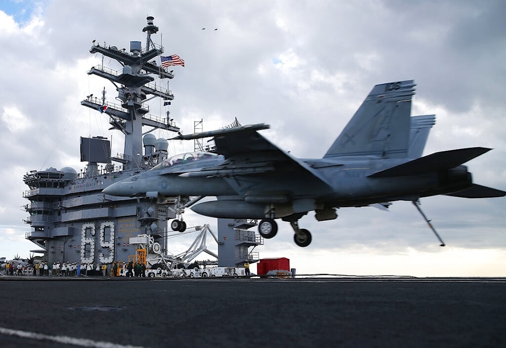 A F18 Super Hornet prepares to land on the deck of the USS Eisenhower off the coast of Virginia, December 10, 2015 in the Atlantic Ocean. (AP)