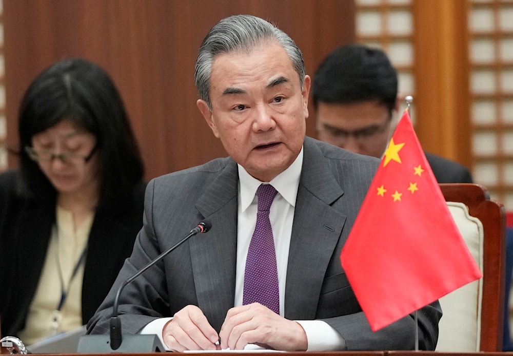 Chinese Foreign Minister Wang Yi speaks during the trilateral foreign ministers' meeting with South Korea and Japan, in Busan, South Korea, Sunday, Nov. 26, 2023. (AP Photo/Ahn Young-joon. Pool)