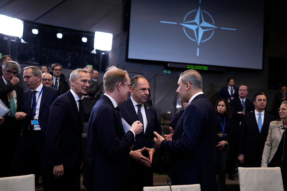 Turkey's Foreign Minister Hakan Fidan, Greece's FM Giorgos Gerapetritis, and Sweden's FM Tobias Billstrom during a meeting at NATO headquarters in Brussels, Nov. 28, 2023. (AP)